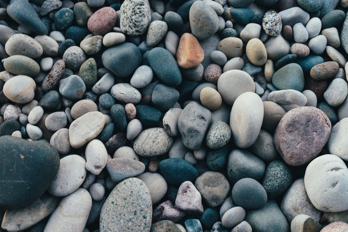Smooth river rock in grey, blue and tan